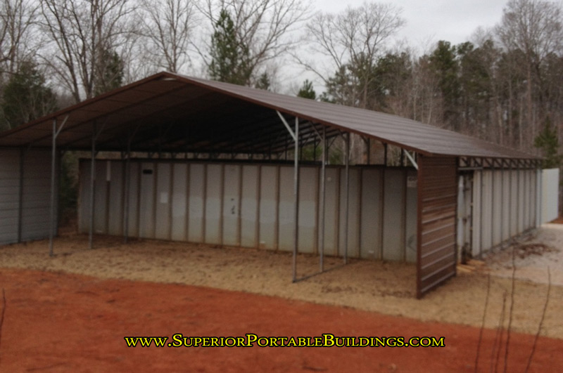 A frame carport for sale with lean tos on each side