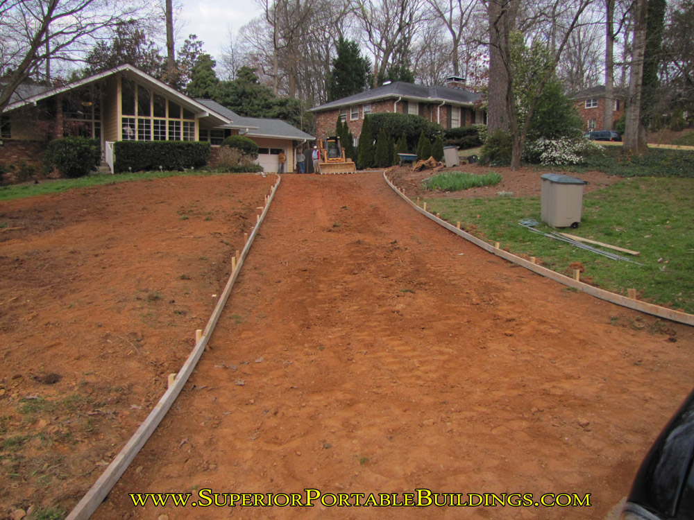 Driveway regraded and packed for new concrete.