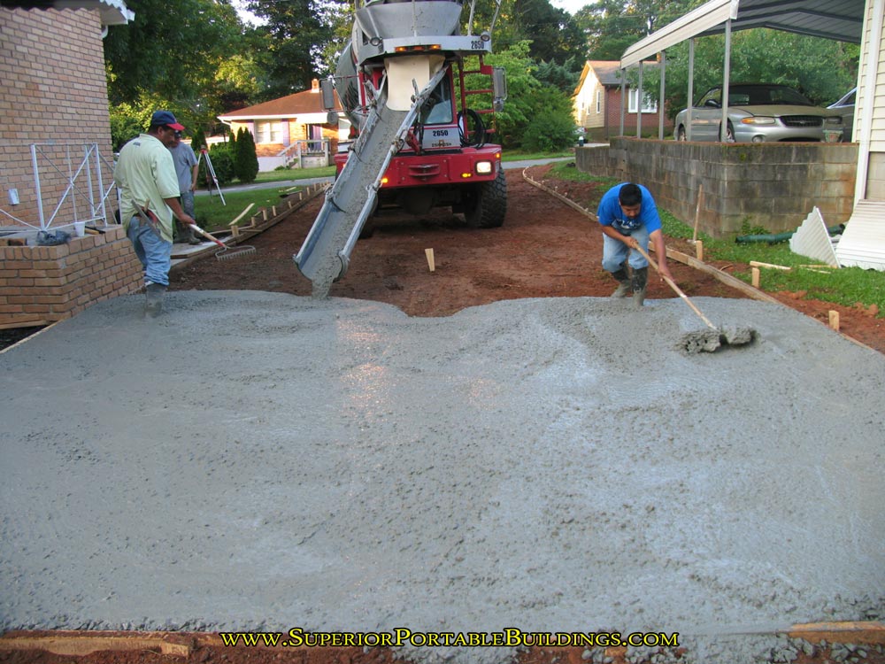 Pouring concrete driveway.