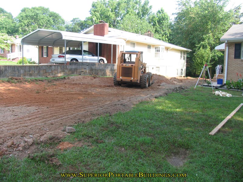 Setting up to grade a wider driveway.